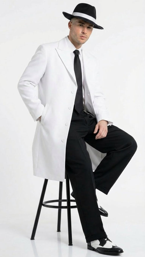 Men's white zoot suit outfit features a long, tailored white jacket with a notched collar and button closure, paired with black trousers. The ensemble includes a black tie and two-tone shoes.