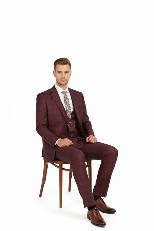 Burgundy checkered three-piece suit for men. Classic fit plaid blazer (notch lapel, single-button), vest, and straight-leg pants. Features a windowpane pattern. Includes a separate floral tie.
