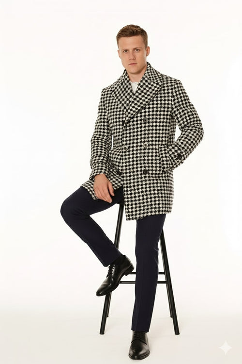 Men's double-breasted overcoat in black and white houndstooth wool blend. Features a wide collar, two rows of buttons, and long sleeves. Tailored fit with a checkered pattern.