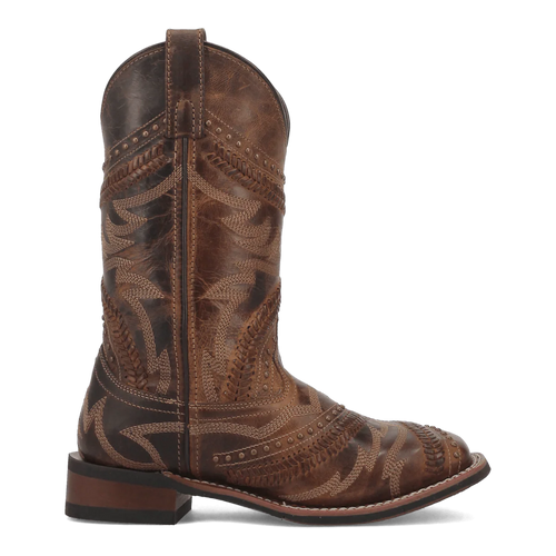 Distressed brown leather Laredo Charli Boot. Tall shaft, pointed toe, stacked heel. Intricate stitching, tonal embroidery, and decorative studs. Flat outsole.
