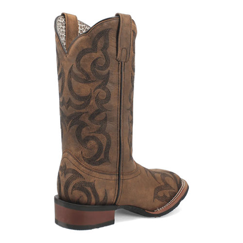 Laredo Sariah women's boot. Tall tan leather shaft with pointed toe, dark brown scrollwork. Stacked heel, pull tab, and contrasting fabric lining.