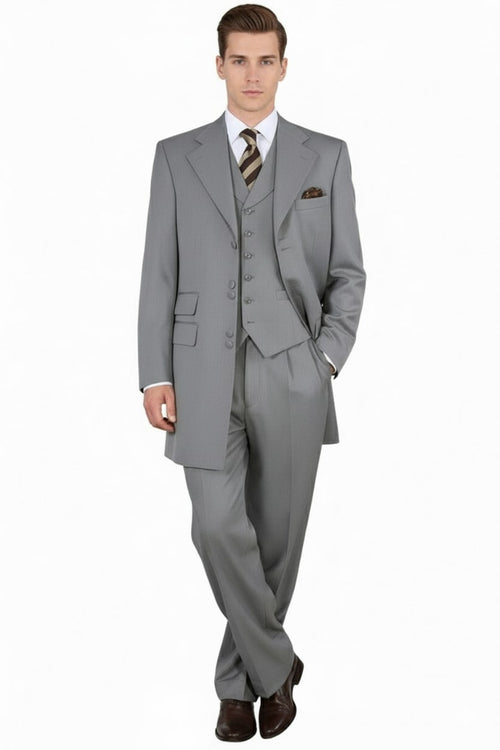 Light gray, three-piece zoot suit. Long jacket with wide lapels, matching vest, and tapered trousers. Smooth fabric with subtle ribbed texture.