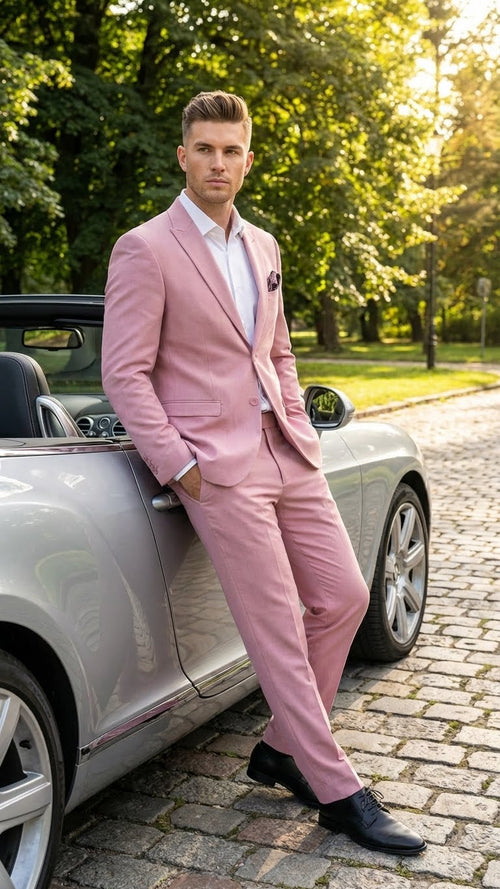 Modern fit men's formal suit in light pink (blush color) with a single-breasted design, featuring a notched lapel, slim trousers, and a pocket square. Material appears to be a smooth fabric.