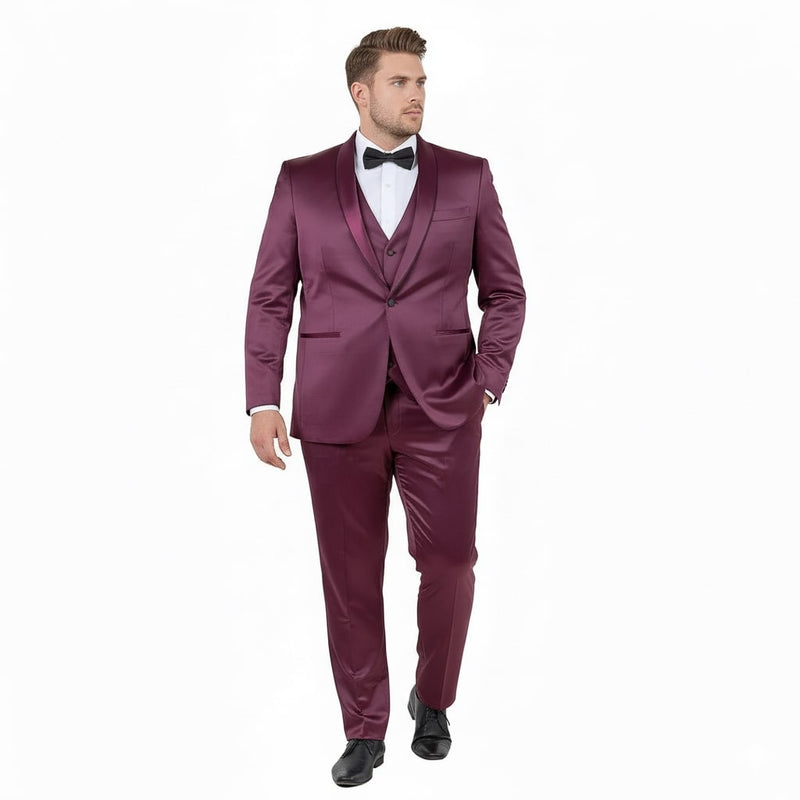 Men's burgundy slim fit tuxedo with a shiny satin finish and shawl lapel. Three-piece suit: jacket, trousers, and matching waistcoat.