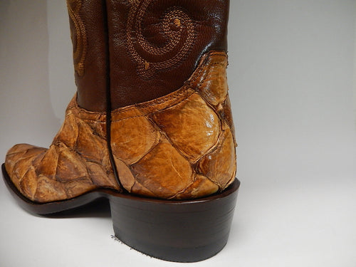 Alberto Nardoni Safari boots: Dark brown leather upper with light brown pirarucu fish skin lower. Pointed toe, block heel. Intricate stitching. Distinct color/material contrast.