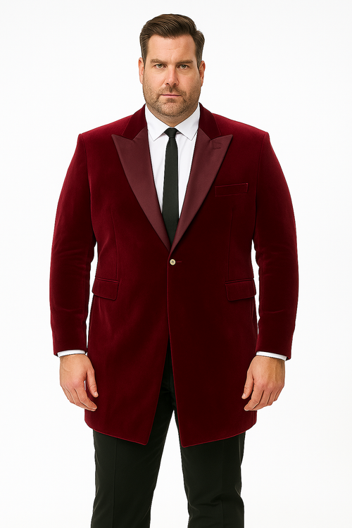 Men's burgundy velvet tuxedo with a tailored blazer. Features a shawl collar, two front pockets, and a single-button closure. The plush fabric suggests high-quality velvet.