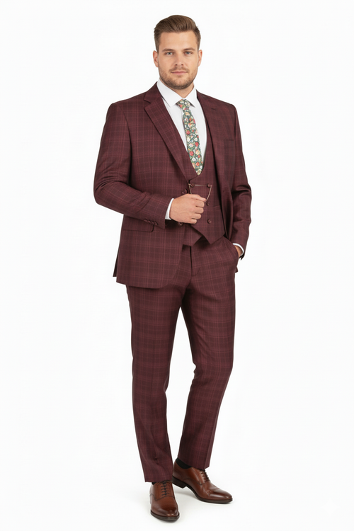 Burgundy checkered three-piece suit. Classic fit blazer with notch lapel, matching vest, and tailored pants in a windowpane pattern. Smooth fabric, deep burgundy color. Blazer features two front pockets and a single button closure, pants with straight legs.