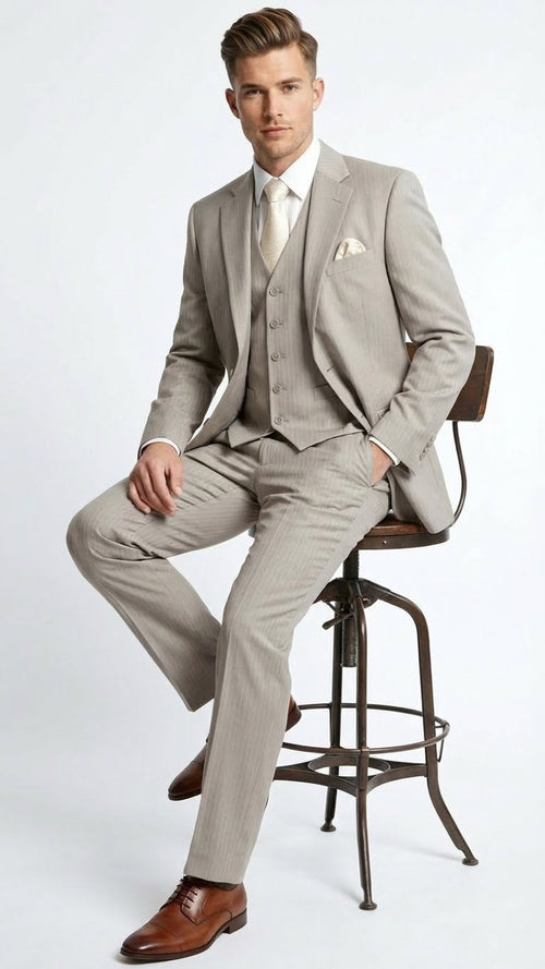 Men's light tan 3-piece suit with vertical pinstripes. Includes fitted, single-breasted jacket, matching 5-button vest, and tapered pants.