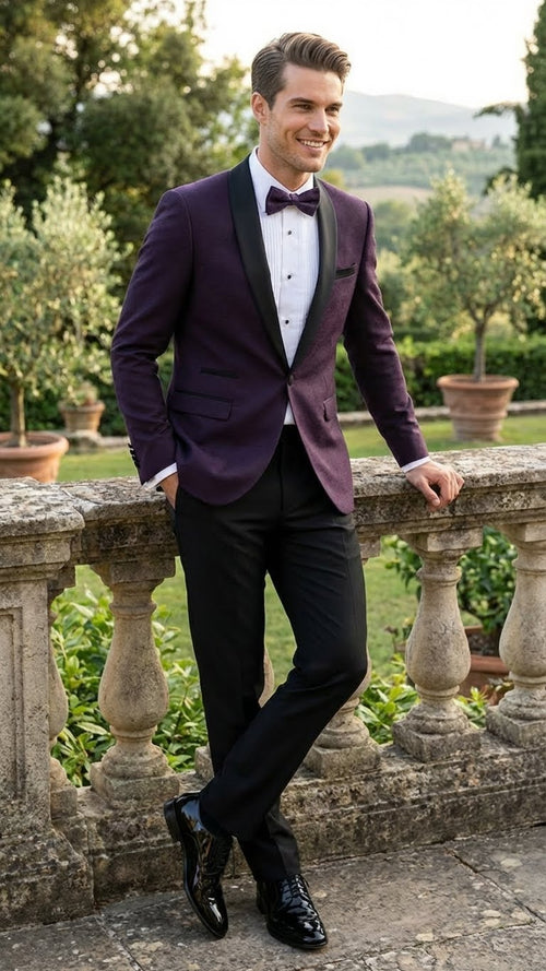 Men's eggplant purple tuxedo blazer with satin lapel & structured shoulders. Tailored fit, smooth fabric with sheen, black button front & side pockets.