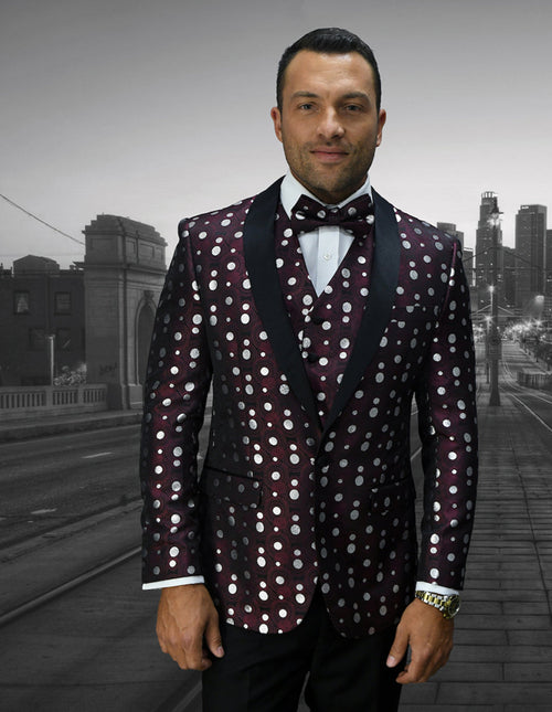 Burgundy Men's Polka Dot Tuxedo: Fitted jacket with wide notch lapel, alternating large/small white polka dots. Matching vest. Deep burgundy with satin lapels. Worn with a white dress shirt.