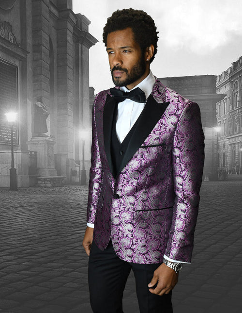 Fuchsia men's one-button tuxedo with peak lapels. Fitted, shiny floral pattern, black satin lapels. Includes a breast pocket and black trousers.