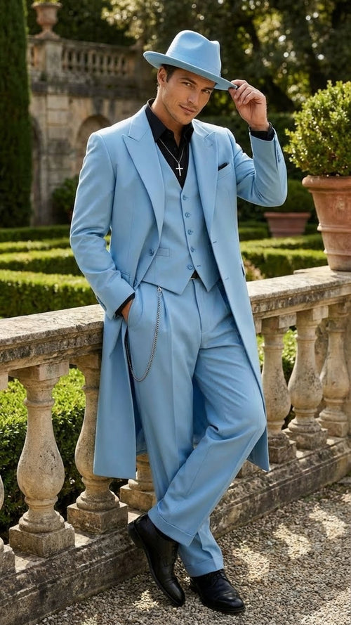 Alberto Nardoni men's light blue zoot suit: long coat, vest, wide-leg trousers. Smooth, lightweight fabric. Single-breasted coat, peaked lapels, pocket square, chain detail. Uniform light blue.