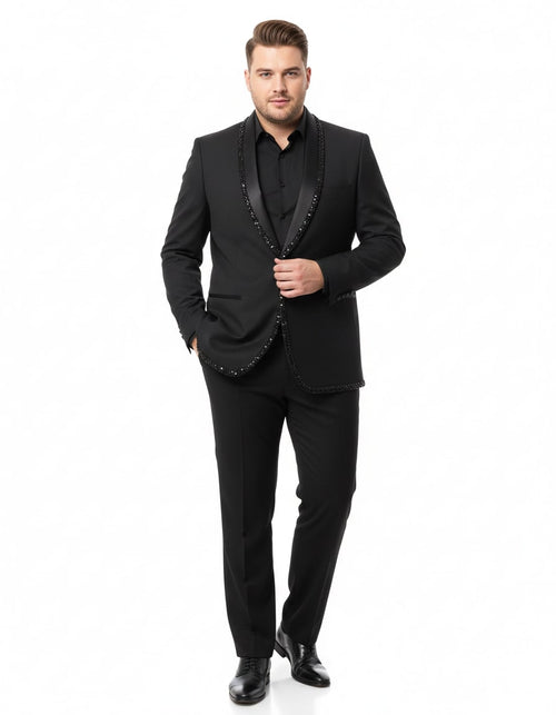 Men's black designer blazer with beaded lapel, structured shoulders, and fitted shape. Solid black material. Paired with matching trousers for a formal, cohesive look.