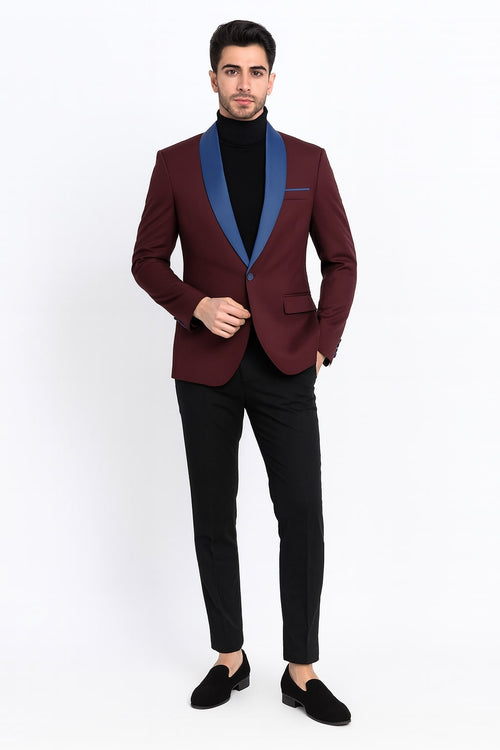 Men's burgundy tuxedo jacket with blue satin shawl lapel. Tailored fit, single-button closure, and chest pocket. Blue satin sleeve accents.