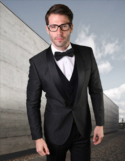 Black men's tuxedo with lace pattern. Fitted structure, black satin shawl collar, and a three-button vest. Enhances a formal look.