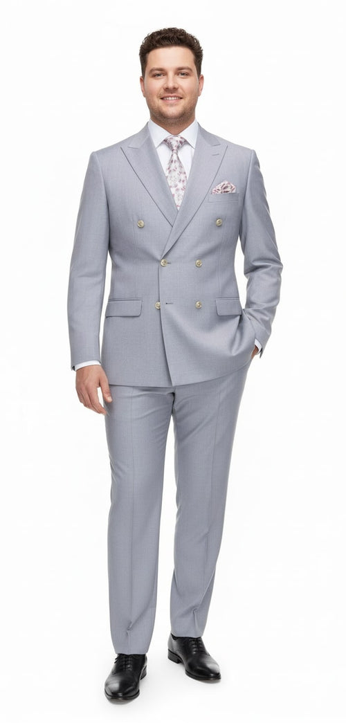 Men's silver-grey 3-piece suit with double-breasted jacket, matching trousers, and vest. Smooth, textured fabric creates a monochromatic look. Paired with black dress shoes.