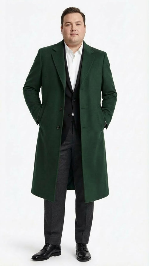 Hunter green men's wool overcoat. Full-length, straight cut with long silhouette. Features notched lapel and two front buttons. Made from wool.