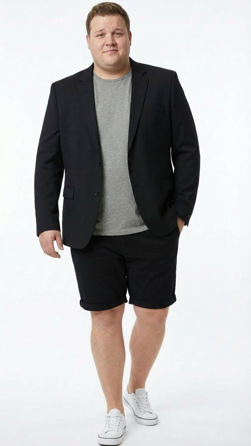 Men's black summer business suit consisting of a tailored blazer and matching shorts. The blazer features a classic cut with notched lapels and two front pockets. The shorts are knee-length with a rolled hem. Both pieces are made from a lightweight, dark fabric.