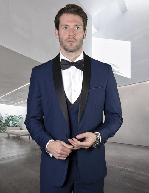 Navy wool tuxedo with a black satin shawl collar, matching double-breasted vest, and black bow tie. Features structured shoulders and tailored fit for a formal look.