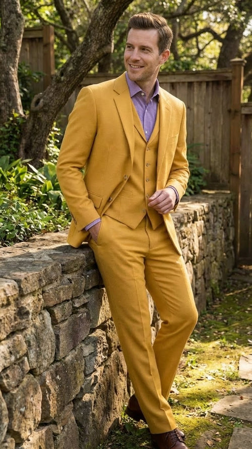 Mustard yellow men's three-piece suit. Modern fit, two-button notch lapel jacket. Includes waistcoat and structured trousers.