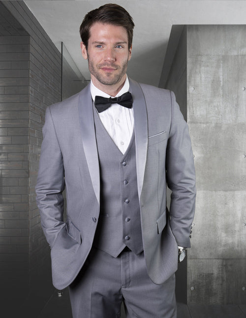 Men's grey wool tuxedo with a modern fit. Features a single-button closure, shawl lapels, and a five-button vest. Includes matching trousers. Smooth texture, no patterns.