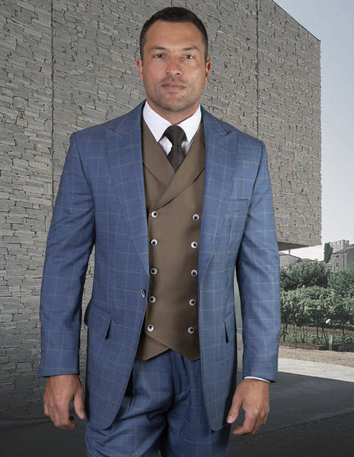 French Blue suit with peak lapel. Classic pleated pant, one-button closure. Tailored fit, subtle check pattern. Includes vest with brown accents.