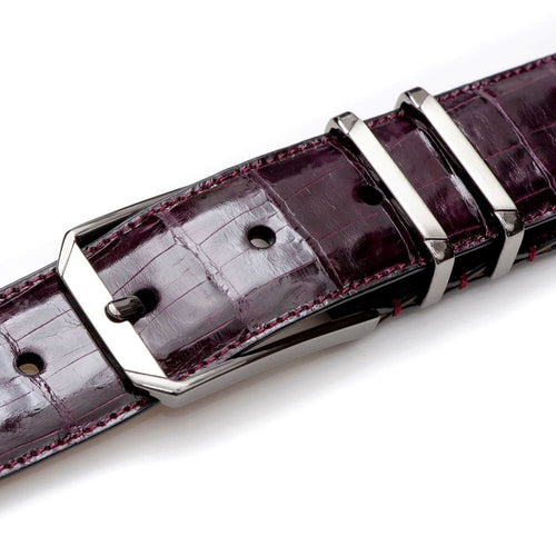 Burgundy Mezlan crocodile belt: textured, glossy finish, reinforced edges, silver buckle. Secure fastening, sophisticated style.