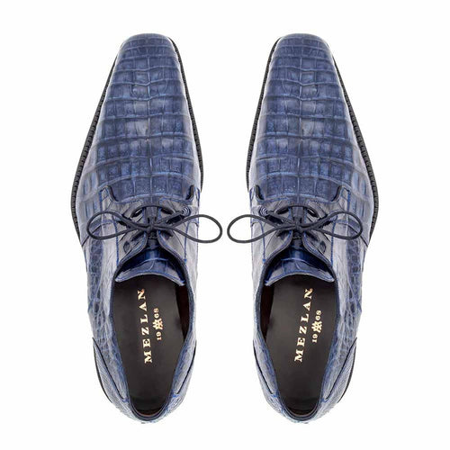 Men's Anderson blue crocodile lace-up shoes with textured reptile pattern, pointed toe, and dark blue finish. Features laces, visible branding, and a structured black sole.