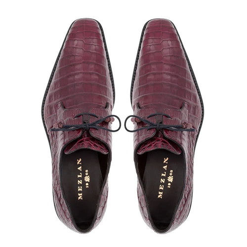 Mezlan Anderson burgundy crocodile lace-ups: Pointed toe, glossy burgundy genuine crocodile leather upper with textured pattern. Black laces, contrasting black sole with slight curve.