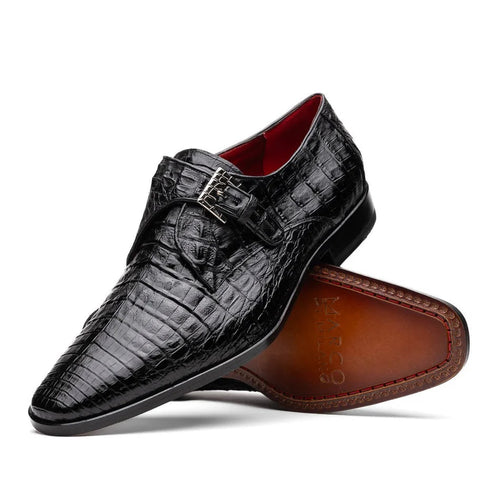Men's black caiman crocodile loafers with a single monk strap. Features: pointed toe, low heel, polished finish, red lining, brown leather outsole with stitching, and a silver buckle.