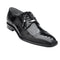 Black ostrich leather Belvedere Batta cap toe dress shoe. Rounded silhouette, polished finish, and textured pattern. Features a classic lace-up design with metallic accents, a sturdy heel, and a smooth outsole.