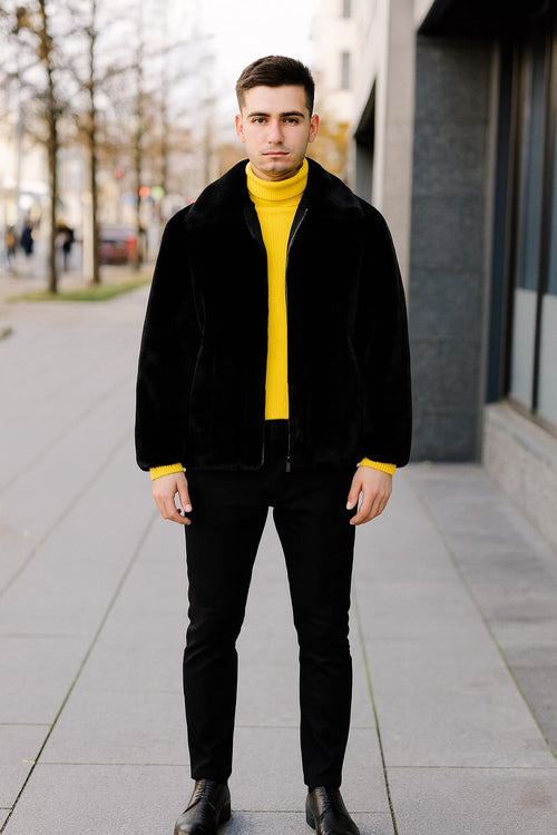 Men's black faux fur jacket. Zip-up front, plush, relaxed fit. Collar. Monochromatic. Made with faux fur.