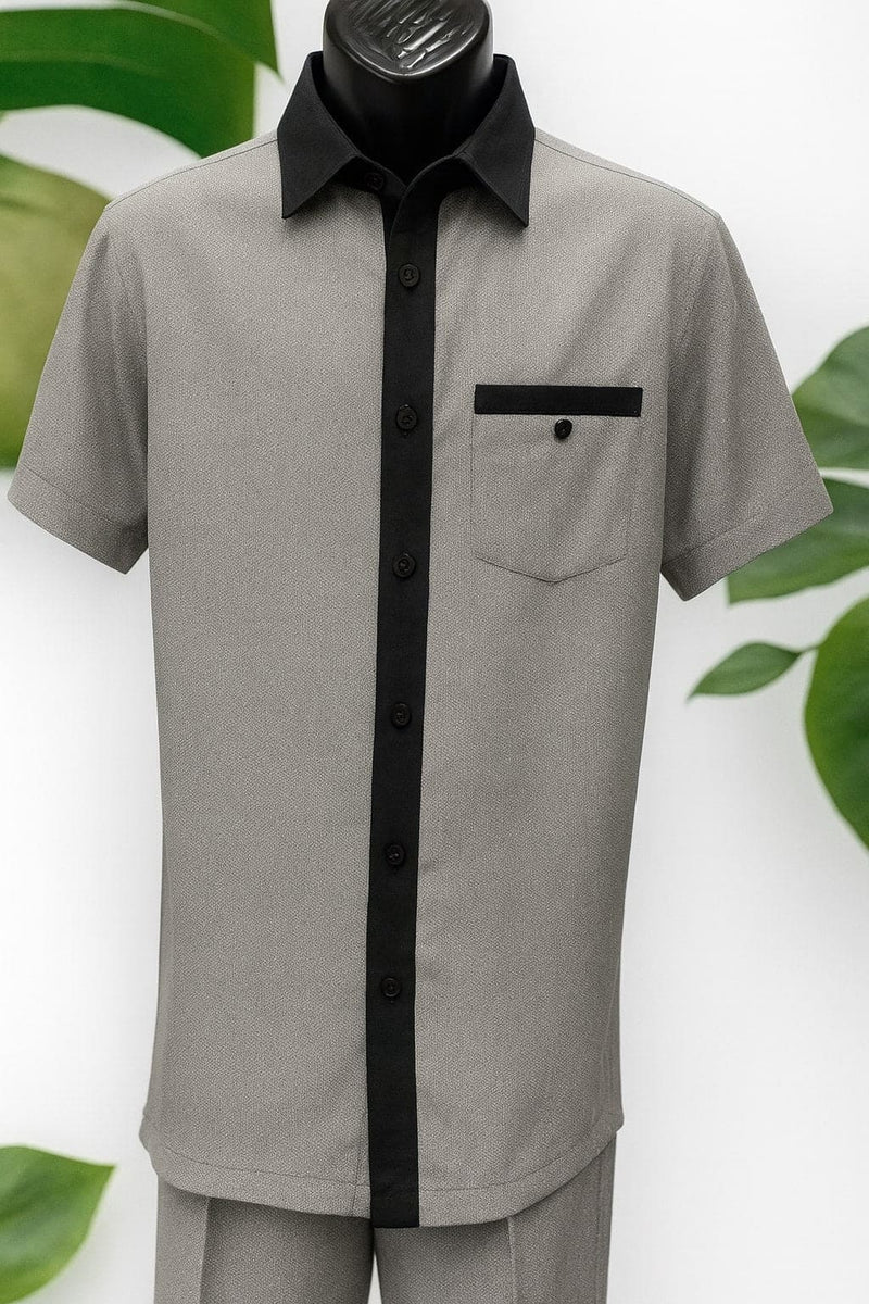 Men's black & white houndstooth walking suit. Light gray body with subtle houndstooth. Black collar, button strip, and pocket trim with single button. Short sleeve design.