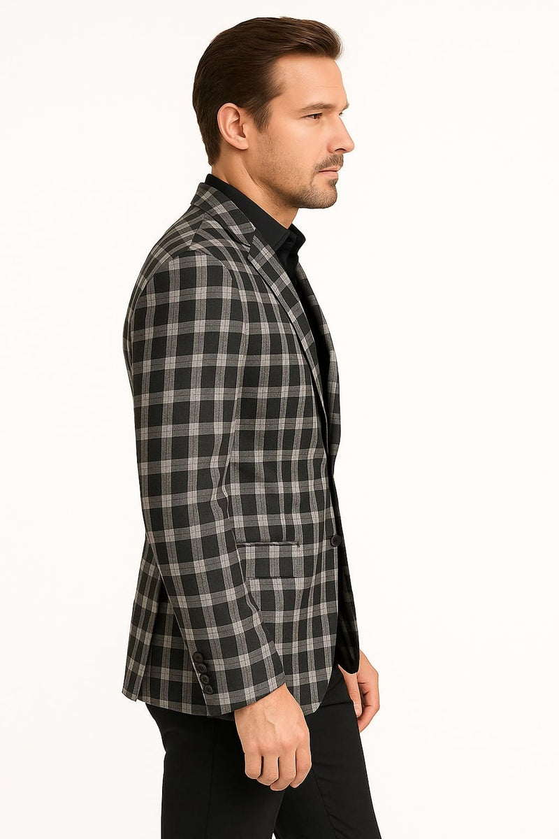 Men's black & white plaid blazer. Structured, single-breasted design. Checkered pattern. Notched lapel, front pockets, and button closures complete the look.