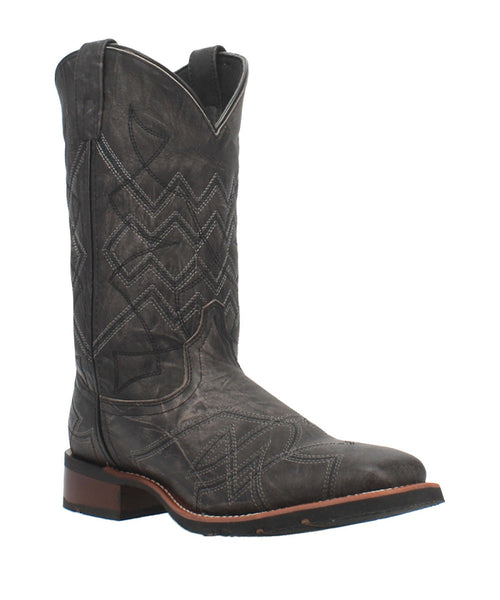 Laredo Axel Black Boot: Tall black leather boot with a distressed finish, pointed toe, and tan stitching. Cowboy style with stacked heel, rubber outsole, and raised cuff.