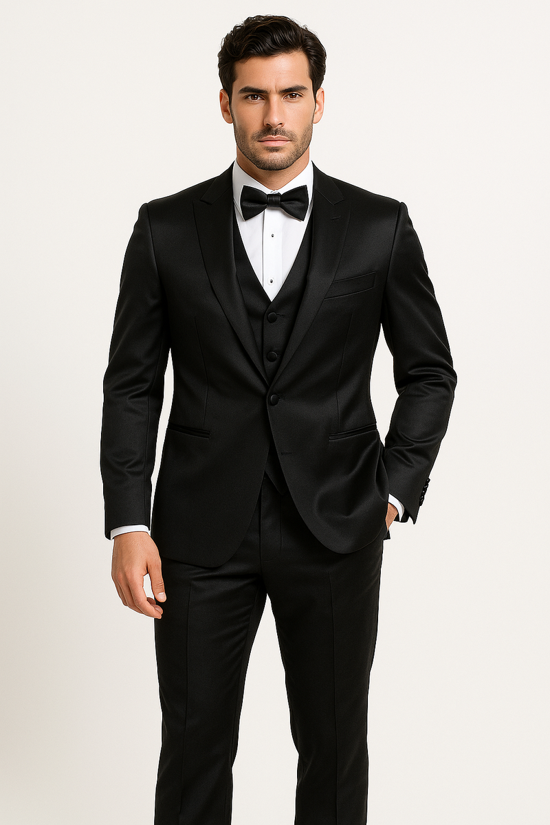 Alberto Nardoni's Black Majesty tuxedo: fitted black jacket with peak lapels, white shirt, black bow tie & trousers. Features a tailored 3-button vest. Sleek, smooth black materials.