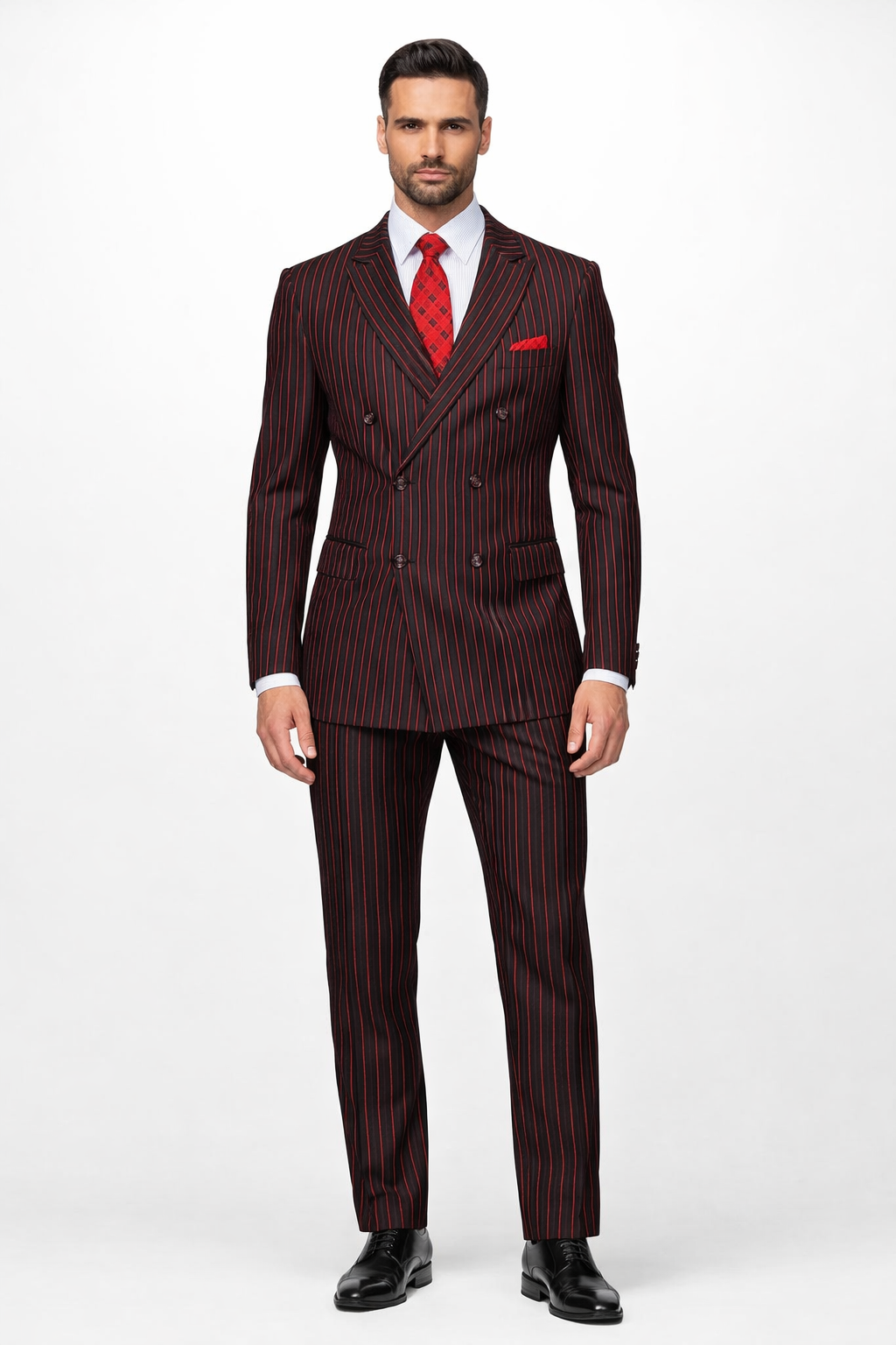 A black and red pinstripe double-breasted suit features a structured jacket with a wide lapel, two rows of buttons, and matching tailored trousers. The stripes are vertical and evenly spaced.