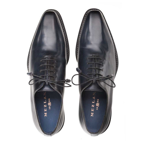Mezlan's Enterprise dress shoes: Deep blue calfskin, plain toe design. Polished upper, rounded toe, classic lacing. Contrasting textured outsole. Smooth interior lining with brand detail.