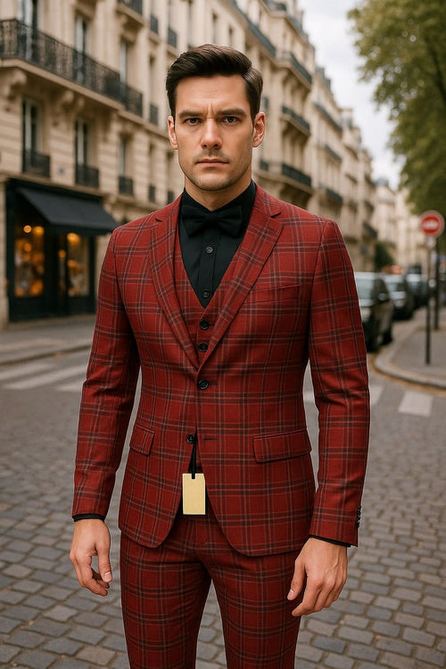 Alberto Nardoni men's burgundy plaid three-piece suit: fitted blazer with structured shoulders, vest, and straight-leg trousers. Features contrasting plaid, front button details, and paired with a black shirt and bow tie.