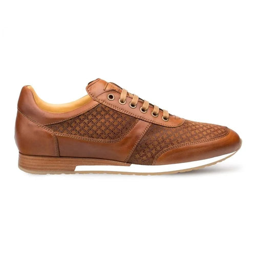 Tan calfskin suede Mezlan Maxim sneakers. Streamlined design with smooth and textured materials, low-top, and a rounded toe. Features patterned suede, leather trim, and a light rubber sole. Luxury meets casual.