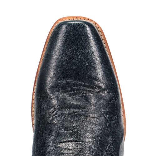 Dan Post men's Calvin boot. Black leather with a pointed toe and smooth finish. Features natural textures and a contrasting, stitched light-colored sole.
