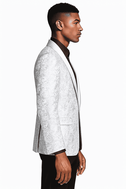Silver grey paisley tuxedo jacket with white shawl collar. Single-breasted, textured fabric, tonal grey, fitted silhouette. Straight hem, formal design.