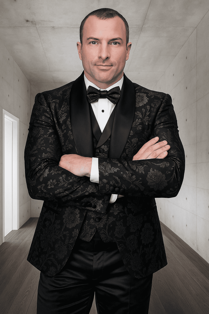 Men's tuxedo with black paisley lace, silky feel, shawl collar, and buttons. Fitted silhouette, elegant vest, and slim trousers.