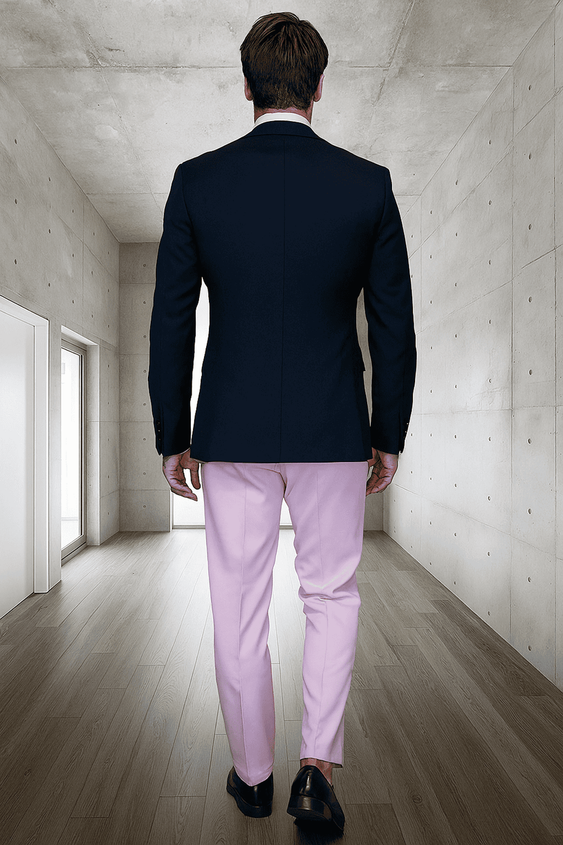 Men's black wool tuxedo: fitted black jacket, light pink trousers. Smooth fabric, striking color contrast. Classic tuxedo with a modern twist.