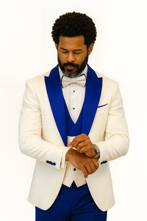 White paisley tuxedo jacket with royal blue accents, peak lapel. Includes matching vest, wool pants, and textured bow tie. A sophisticated ensemble.