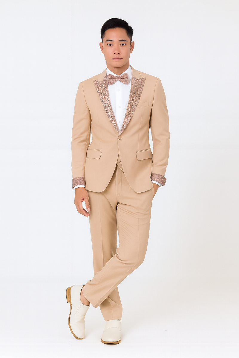 Men's champagne rose gold prom tuxedo: tailored light beige jacket with rose gold lapel, white shirt, beige trousers, rose gold bow tie. Fitted jacket, straight-leg trousers. Includes light-colored dress shoes.