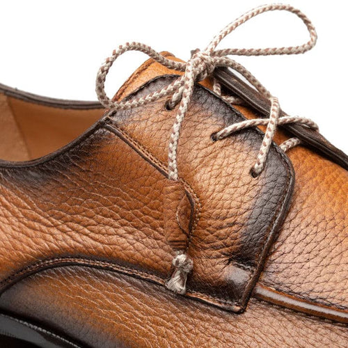 Men's Fratello cognac split toe shoes. Crafted from textured deerskin with a smooth finish & contrasting stitching. Features a split toe design and traditional lace-up closure.