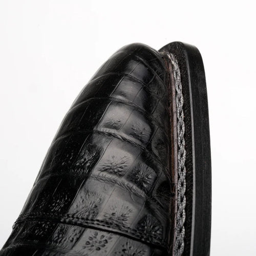 Mezlan's Giovane derby: Black genuine crocodile cap toe. Shiny, pointed design with distinct pattern and detailed stitching. Narrow, sturdy sole. Elegant and structured.