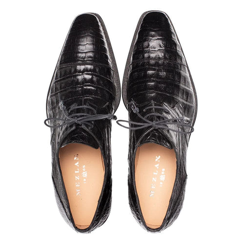 Mezlan's Giovane derby: Black genuine crocodile cap toe. Sleek pointed shape, glossy black leather upper. Structured silhouette with laced front, refined stitching. Tan leather interior.