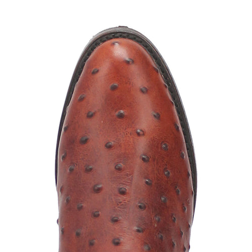 Brown lizard-print leather boots with a pointed toe and textured surface. They have a rugged, raised pattern and a sturdy black sole.